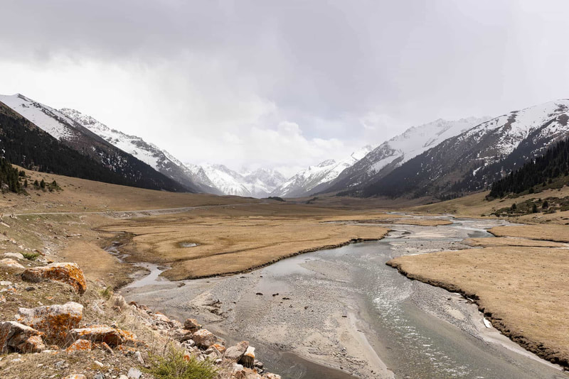 Wide shinglebed river in a valley of Kyrgyzstan.
